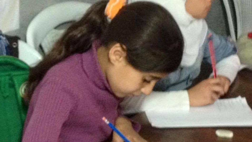 Syrische kinderen op school in Libanon